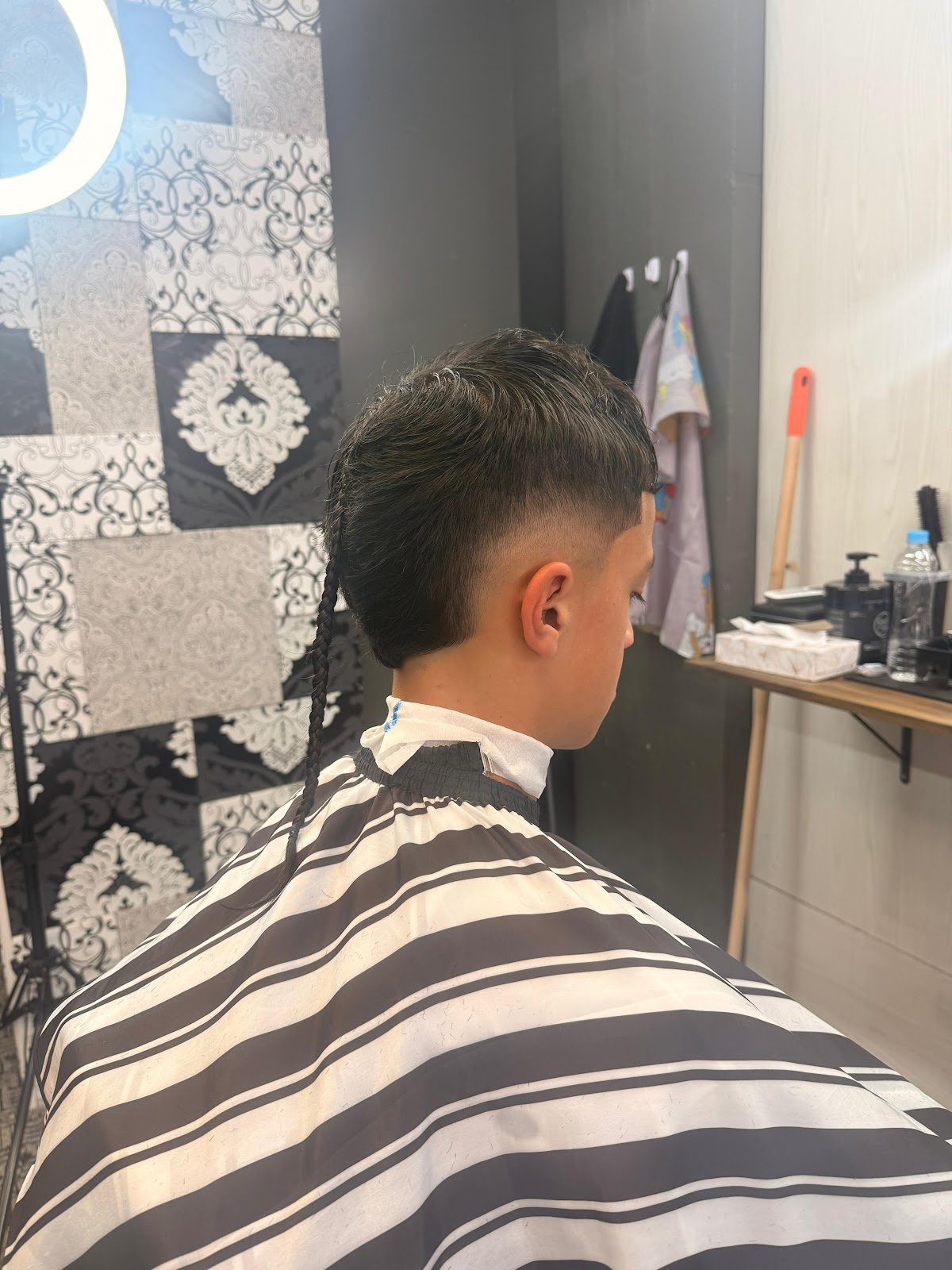 Mullet with braided tail and burst fade