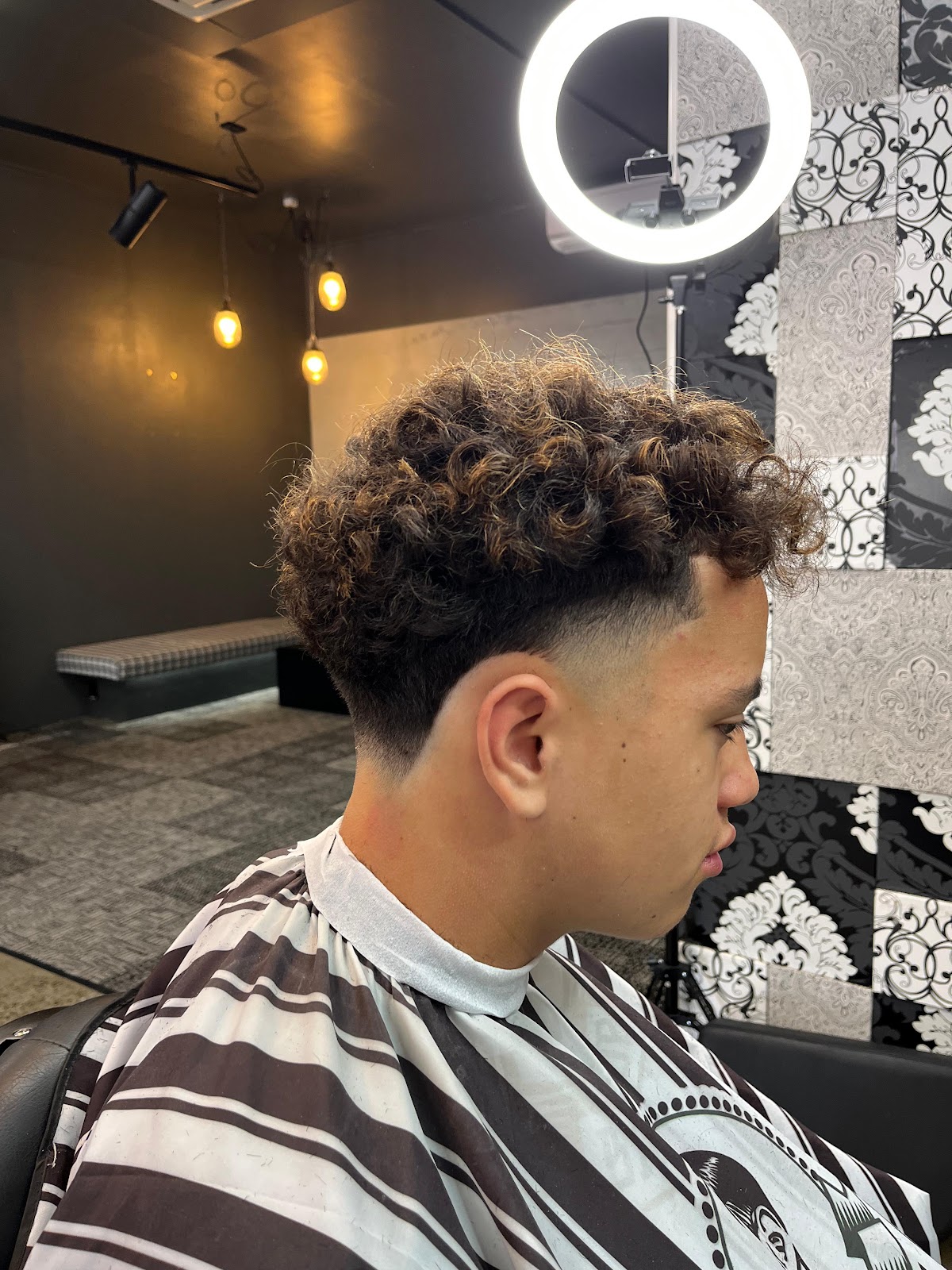 Curly top with low drop fade